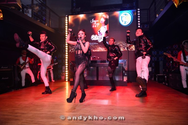 A live band was belting out popular hits and the crowd responded enthusiastically