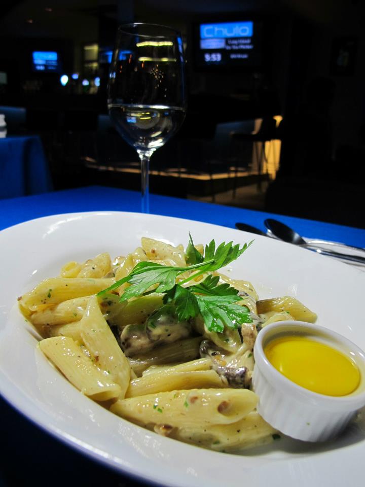 Spaghetti Carbonara - see the egg yolk on the side? Quickly pour it in when your dish arrives so the heat from the dish will cook the egg. Not bad but with all carbonaras I suggest you share this with someone.
