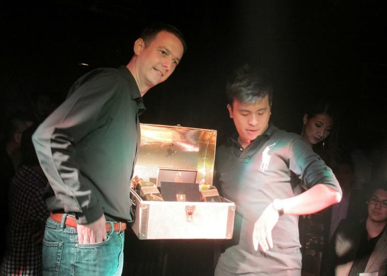 Who remarkably was checking his watch while receiving his prize. Wonder what he was thinking. Perhaps damn now it's too late to go to the goldsmith shop to sell off my gold bar.