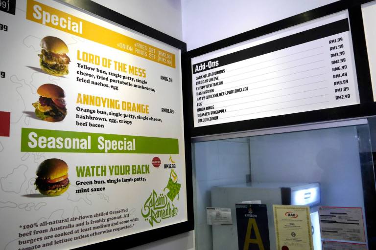 Specialty burgers + add-ons.