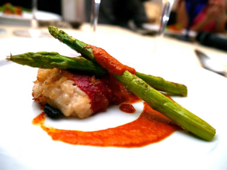Cava’s Specialty Piquillo Peppers Stuffed with seafood, served with creamy piquillo sauce and asparagus 