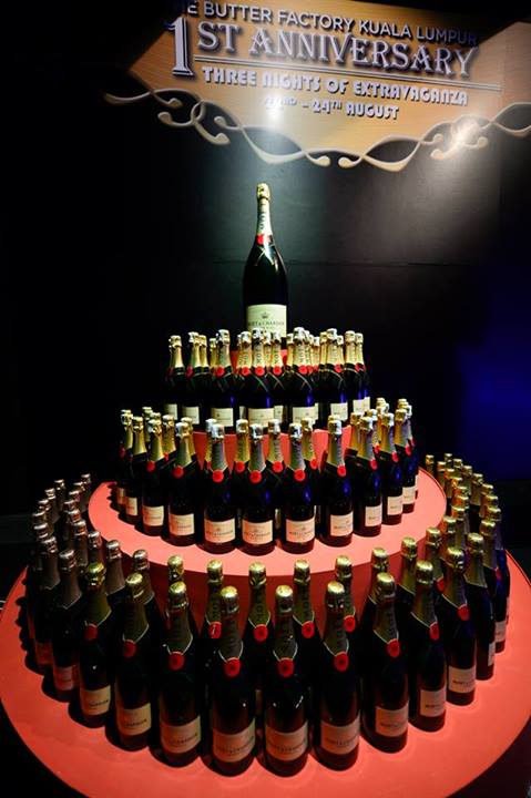 The birthday "cake" was made out of 111 bottles of Moet & Chandon champagne which were later given out to guests