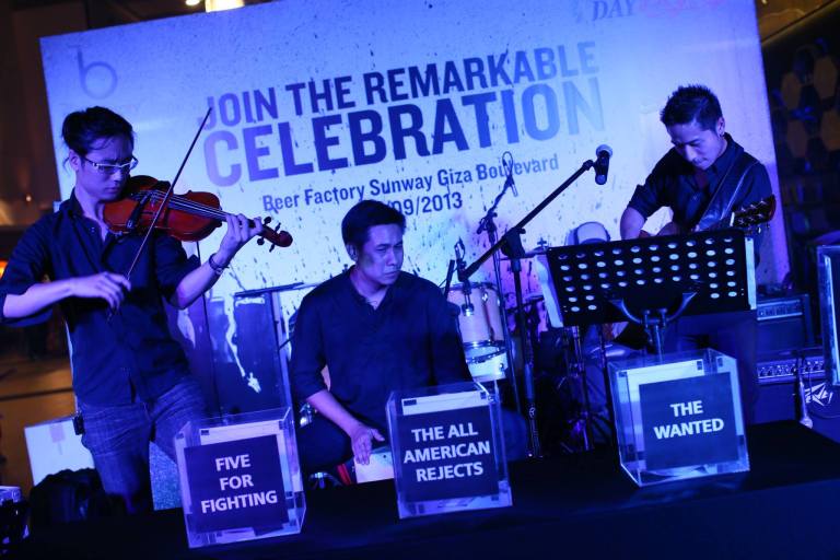 There were live bands performing and one of which was the "Human Jukebox" which would play a song by one of the 3 bands performing at Arthur's Day 2013 whenever someone dropped their entry into the respective box.