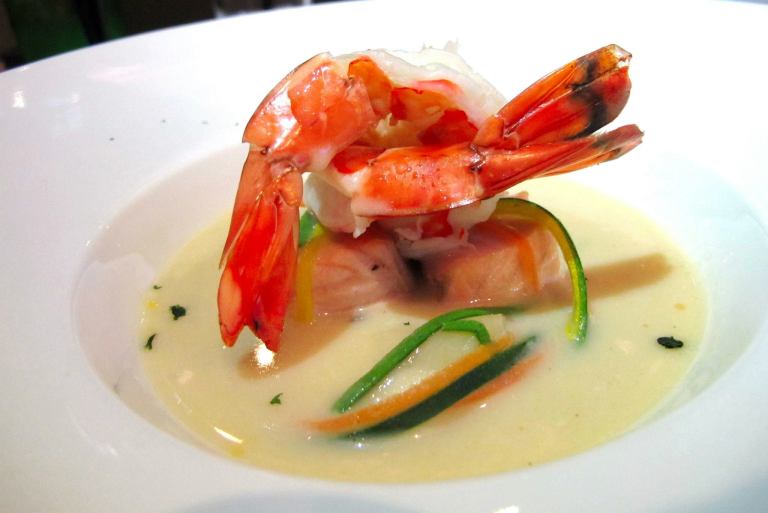 Bergen Traditional Fish Soup - A savoury light cream seafood soup with scallops, prawns, salmon and vegetable julienne - RM25