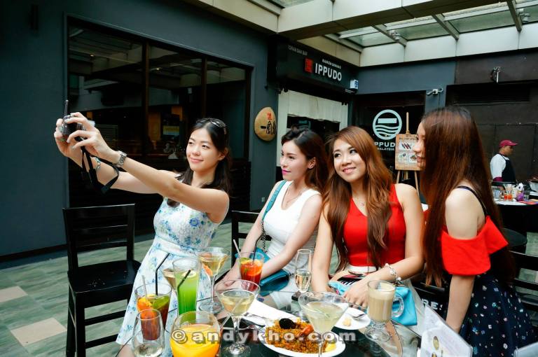 The girls trying out the 180 degree flip screen on the new Sony Alpha 5100