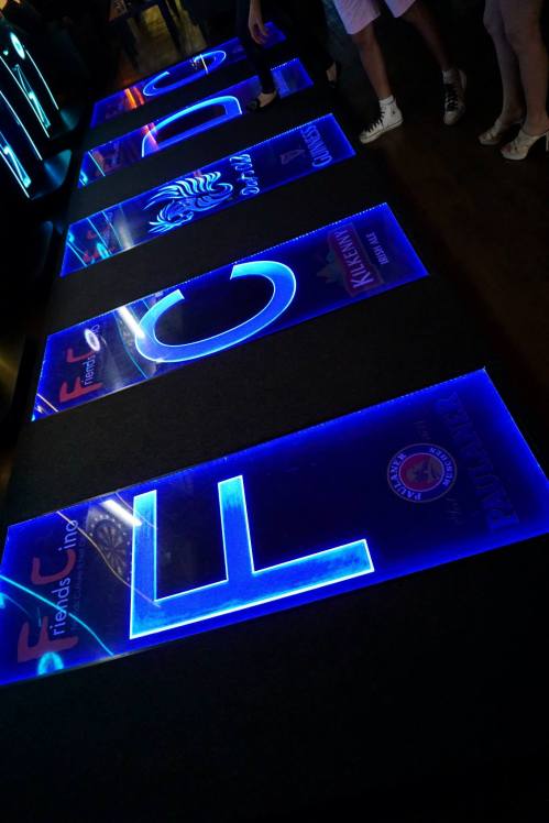 In place of the normal mat which measures the minimum distance is a slightly raised and lit platform which effectively stops players from encroaching over the minimum distance.