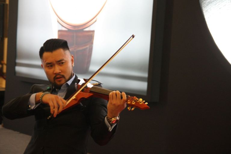 Malaysian violinist Dennis Lau, supported vocally by upcoming singer, Michael Leaner, entertained the guests
