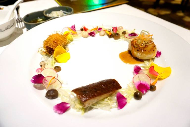 Pan-fried dragon beard prawn with green tea, stuffed Peking duck, seared Hokkaido scallop & mushroom blossom