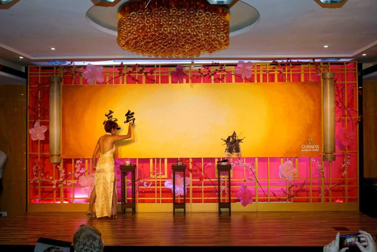 Haze Leong started off the evening with some caligraphy