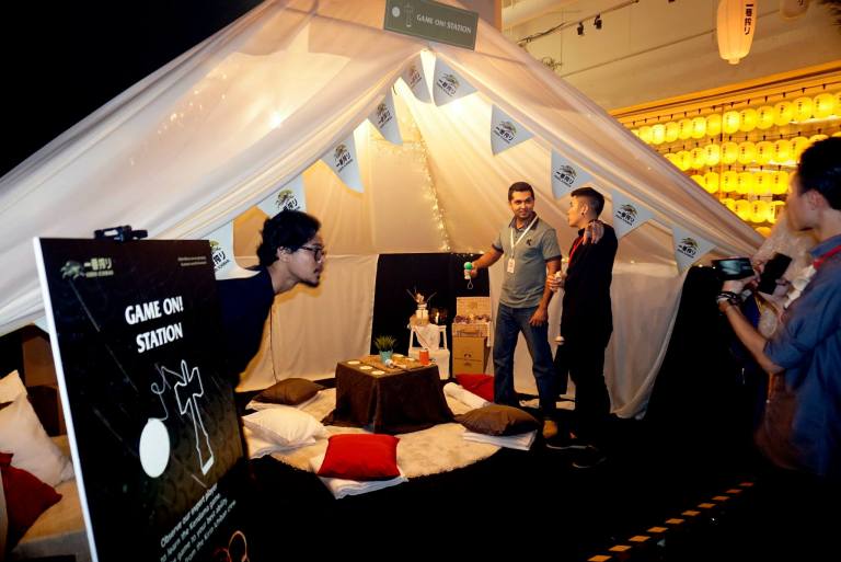 There was also this tent where we got to play Kendama which is a traditional Japanese game that requires good hand-eye coordination and motor skills. That's the Thirsty Blogger Deepak giving it a go.
