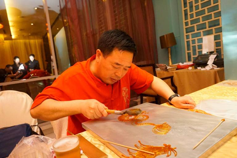 We were kept occupied by some artisans such as Chinese caligraphy, animal shaped candy, and the cute animals on a stick