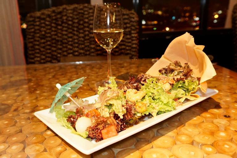 Summer Salad with prawns, baby octopus, lychee and greens with a light sesame dressing