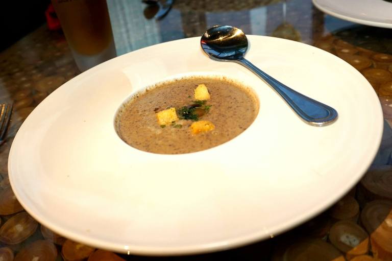 Signature Mushroom Soup – with truffle oil, sautéed chanterelle mushrooms, blended trio of wild mushrooms, and creme.