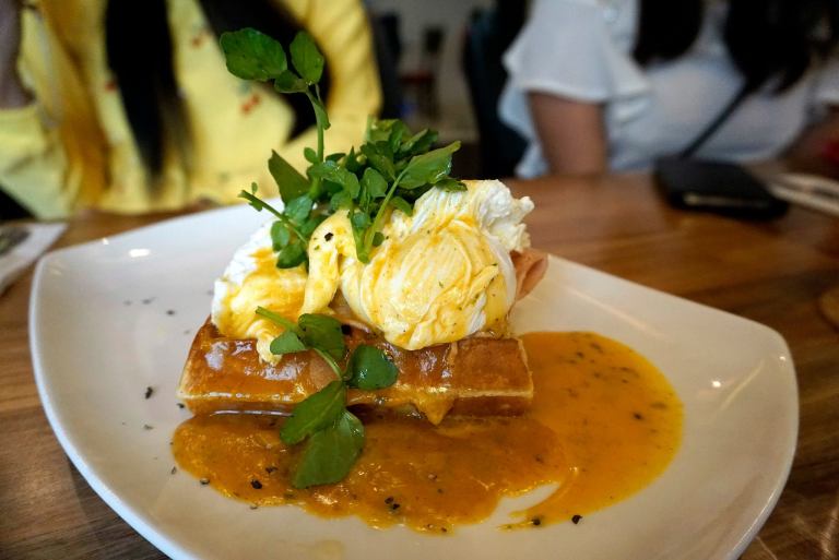 Down Home Benny - RM18.00 - waffle with beef bacon, poached eggs, hollandaise sauce, avocado and watercress salad  