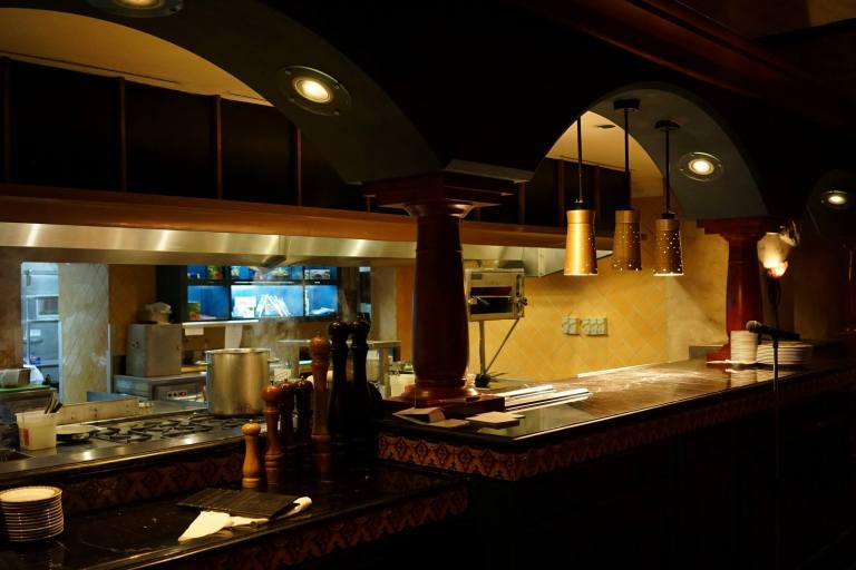 Open kitchen where you can watch the chefs prepare the food