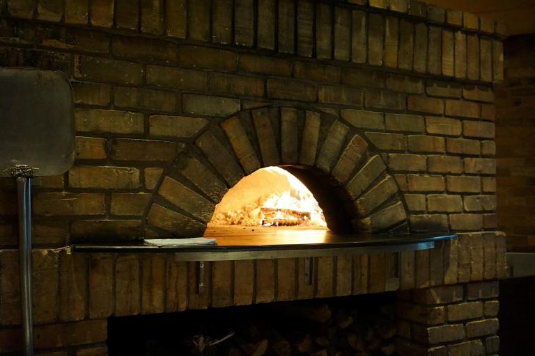 Large brick oven where the pizzas are baked