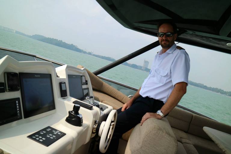 Captain Neil at the helm