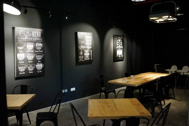 The cafe is nicely decorated with the black walls being the differentiation factor from other cafes