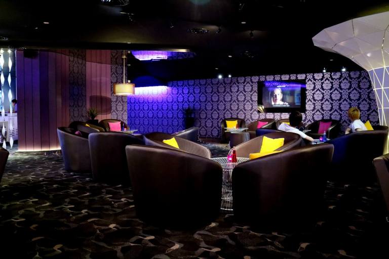 The lounge area which houses sofas and low tables - great for relaxing over some drinks while waiting for your movie