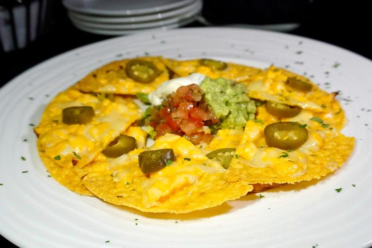 Baked nachos with sour cream and guacamole - RM25.00