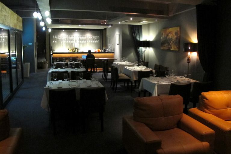 The second floor houses the (smoking) dining section, wine cellar, cigar lounge, and a private room. The upstairs section has a maximum seating capacity of 35 persons.