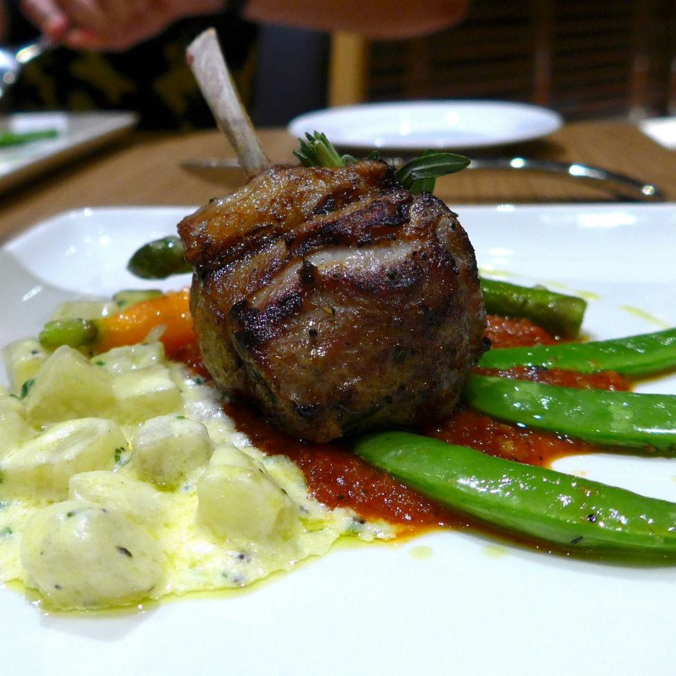 Pan-Fried Rack of Lamb set onto Yellow Kumara Ragout napped with Wild Rustic Sauce