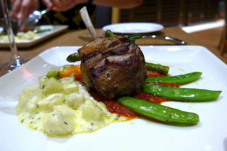 Pan-Fried Rack of Lamb set onto Yellow Kumara Ragout napped with Wild Rustic Sauce
