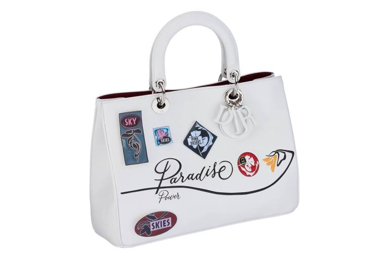 Diorissimo bag in white paradise calfskin, badges and flower in embossed leather