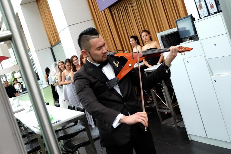 Violinist Dennis Lau provided the tunes for the wedding march
