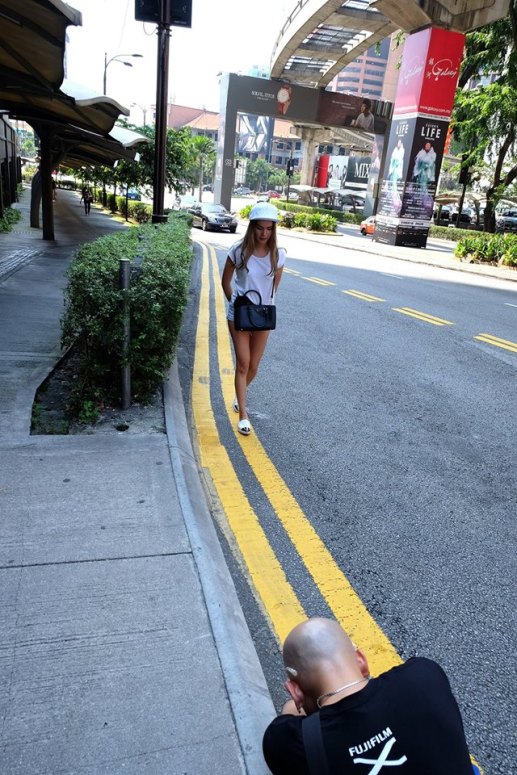 We were given a specific route to follow which brought us from Fahrenheit88 to the Imbi market area, past Pavilion to Jalan Sultan Ismail and then back to the starting point. Along the way we had to shoot 10 photos to fit the various categories given to us. First up was "Motion & Lines" and I caught this pic of Andy shooting Stephanie along the roadside.