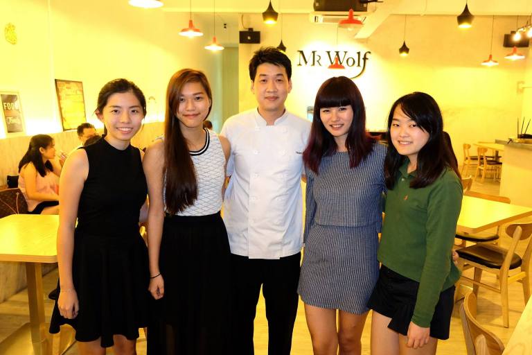 The girls with the chef and owner of Mr. Wolf