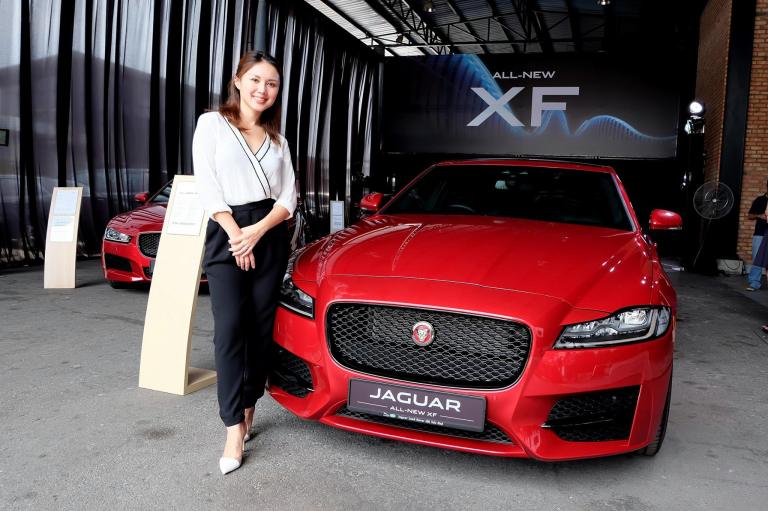 MC of the event, Julie Woon with the new Jaguar XF