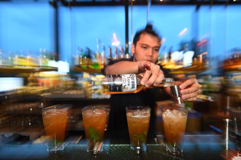 The bartender preparing the special Corona cocktails for us