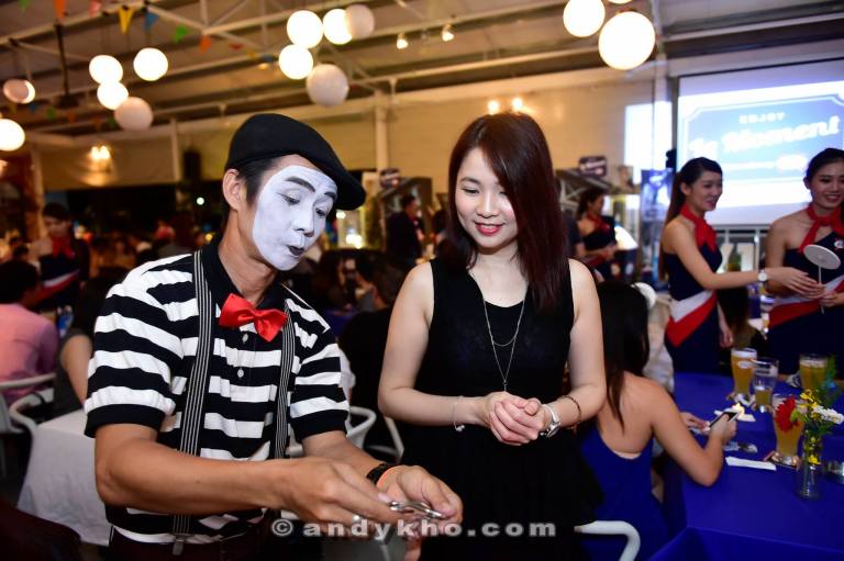 A magician entertaining Kassey with his tricks