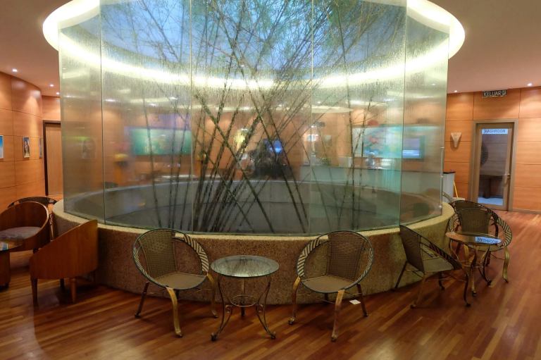 The large and comfortable waiting area has lots of chairs and tables for you to rest while you await your turn