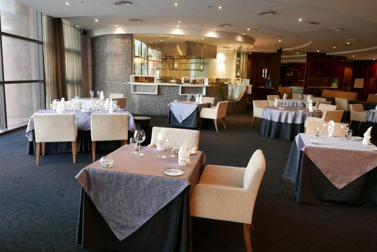 The main dining area offers a nice view of the bustling city below