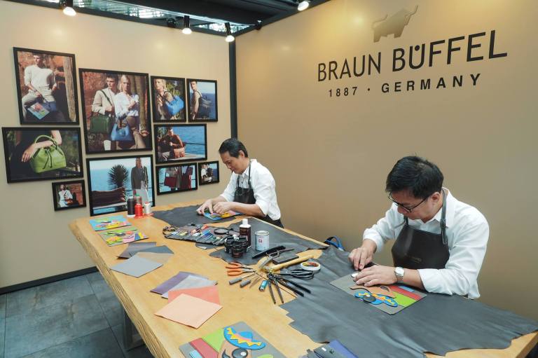 Demonstration by two of the house’s artisans who handcrafted the intricate leather embellished details of Buffy & Bully, the brand’s whimsical representation of the buffalo icon