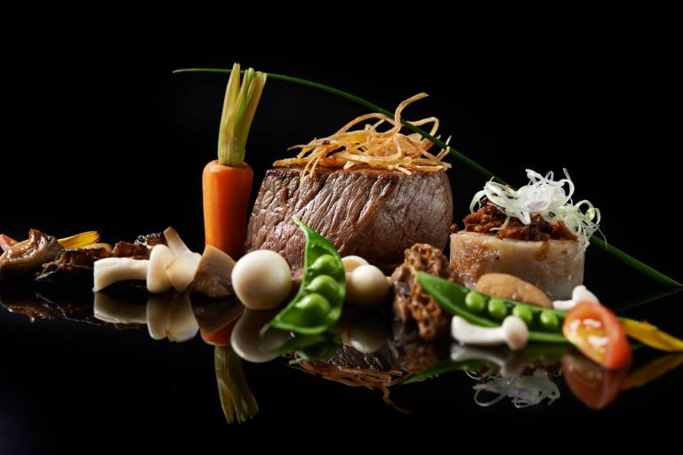 rklh-wok-seared-beef-of-tenderloin-carrot-cake-greens-mushroom-cream-sauce