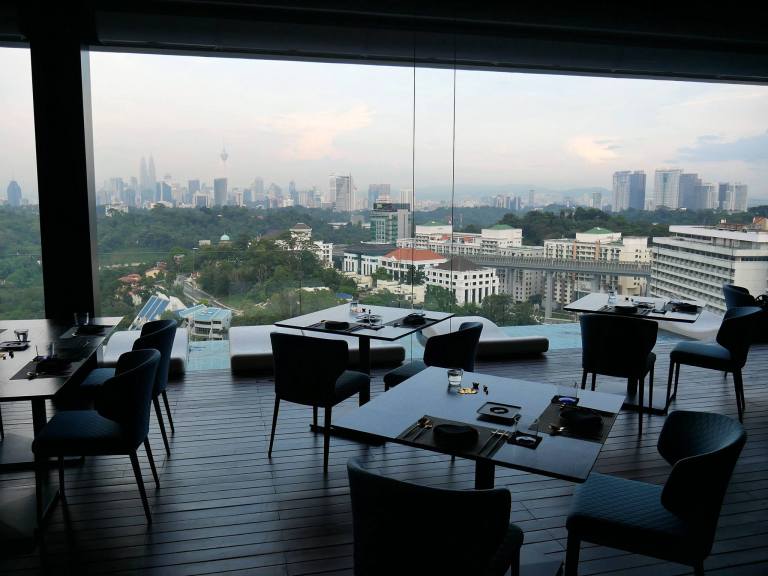 The "balcony" dining area which is air conditioned and has a lovely view of the KL skyline
