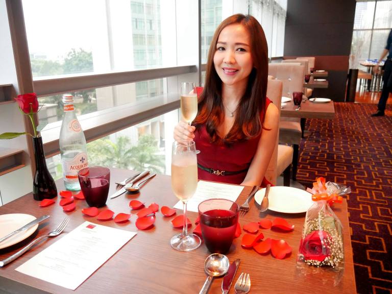 The table was decorated with rose petals while there was a flower for her