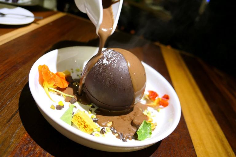 Warm chocolate is poured on it