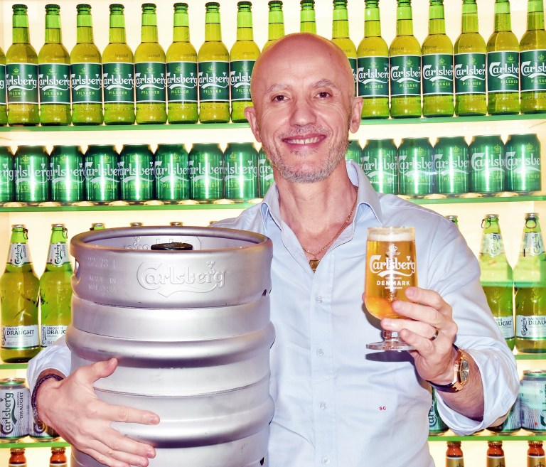 Stefano Clini, Managing Director of Carlsberg Malaysia with a beer keg adopt a beer 2020