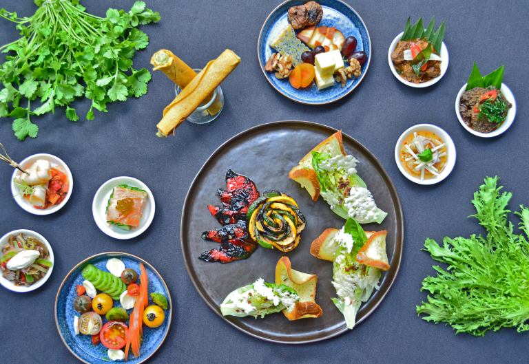 Hickory-Smoked Chicken with Vegetable Ratatouille, Tea Tree-Smoked Norwegian Salmon and Potato Feuille, Artisan Heirloom Tomatoes with Buffalo Mozzarella, Assorted Cheese Platter, Classic Caesar Salad with Condiments, Classic Fillet Stroganoff, Beef Rendang, Fried Seabass with Thai Sauce and Mango Salad