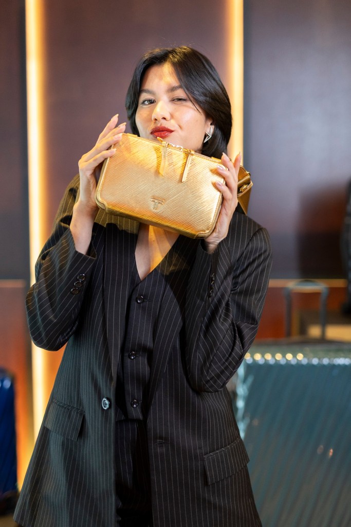 Alicia Amin with the Voyageur Myla Crossbody in Gold