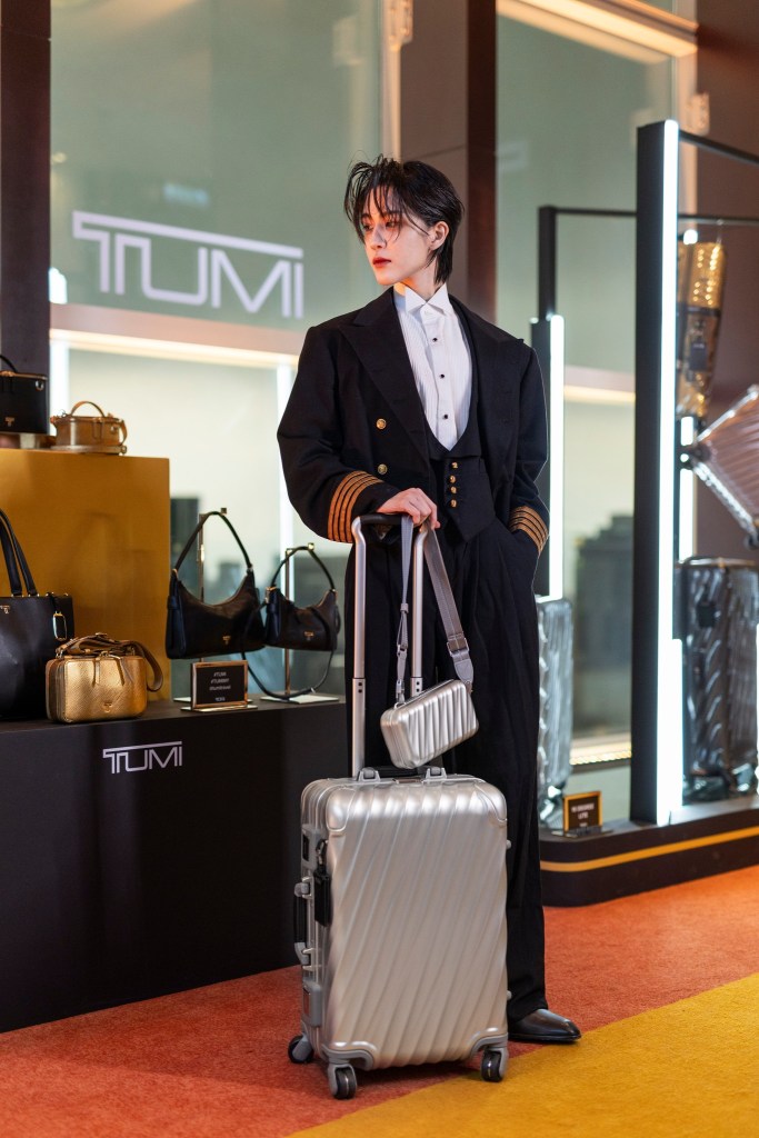 Hakken Ryou with the 19 Degree Aluminum International Expandable Carry-On and 19 Degree Aluminium Compact Sling in Silver