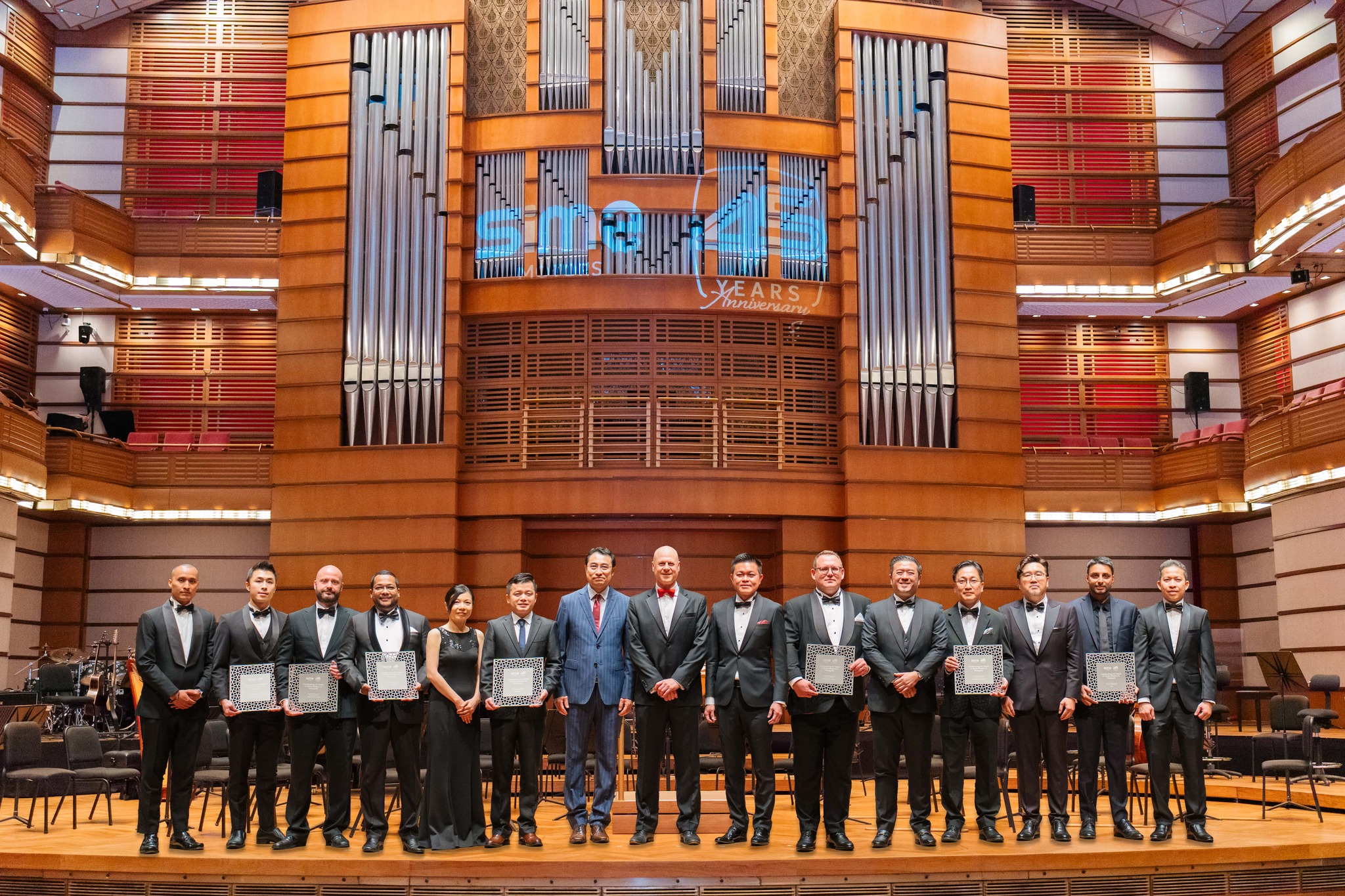 Tokens of appreciation were presented to representatives of Sime Motors' brand principals. From left: Mr Mohamad Hanif, Head of Operations of Sime Swedish Auto; Mr Ryan Eng Yi Hong, Area Manager of Volvo Cars Malaysia; Mr Christopher Hunter, Chief Executive Officer of Porsche; Mr Syed Ahmad Muzri, Managing Director of Inokom & Distribution Malaysia for Jaguar Land Rover; Ms Adeline Lew, Managing Director of BYD Sime Motors; Mr Eagle Zhao, Managing Director of BYD Malaysia; Mr Liu Xueliang, General Manager, BYD Asia Pacific, Auto Sales Division; Andrew Basham, Managing Director of Sime Motors; Mr Jeffrey Gan, Managing Director of Southeast Asia for Sime Motors; Mr Benjamin Nagel, Managing Director of BMW Group Malaysia; Mr Vi Thim Juan, Managing Director of Retail for Malaysia & Indonesia; Mr Eric Lee Dong Wook, President of Hyundai Motor Malaysia; Mr Joey Lin, Managing Director of Sime Auto Hyundai; Mr Navin Gulati, Sales Zone Manager for Ford Asia Pacific Distribution Market and Mr Turse Zuhair Nahason Affan, Managing Director of Sime Auto ConneXion.